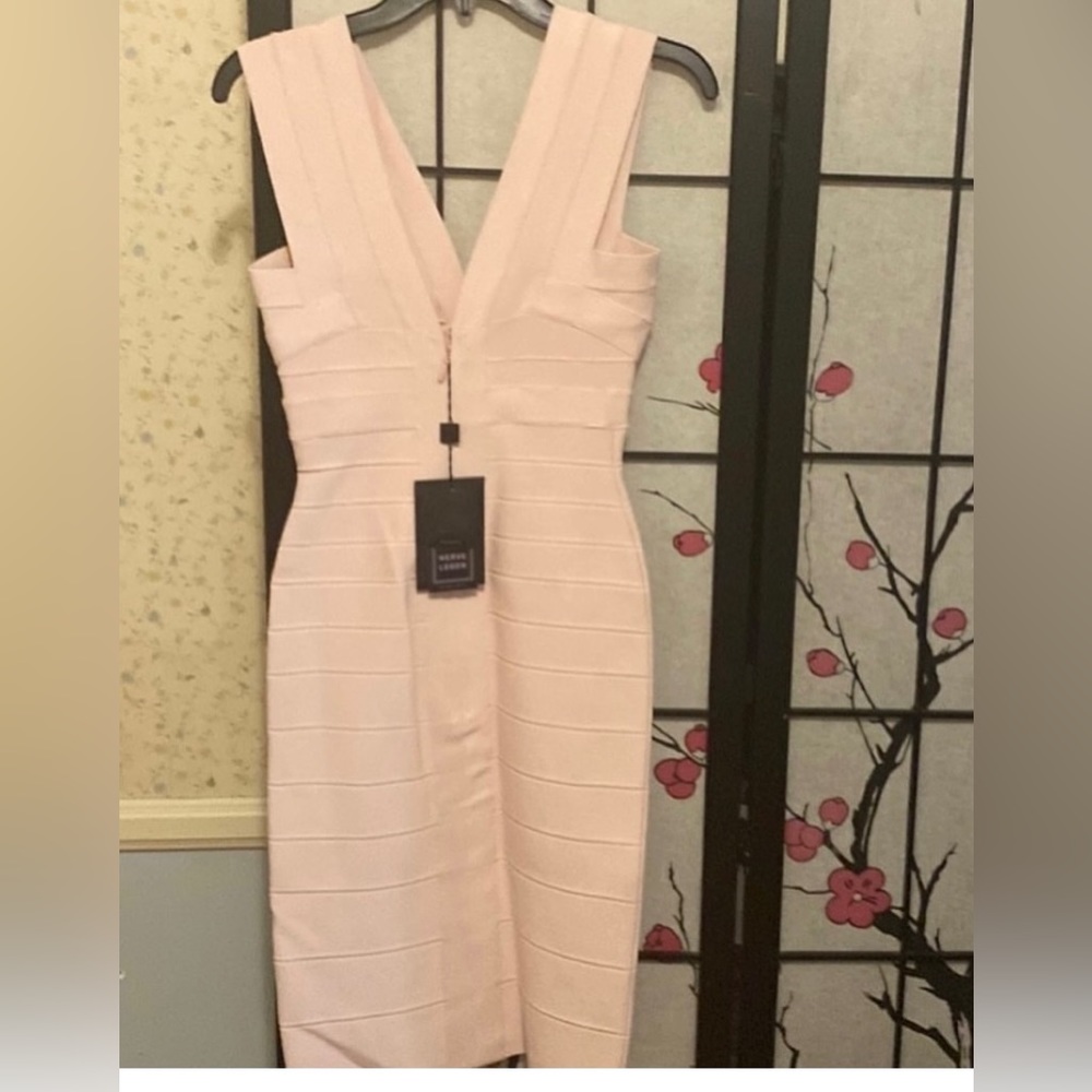 Brand new Hervé Léger dress with tags, baby light pink, size small .